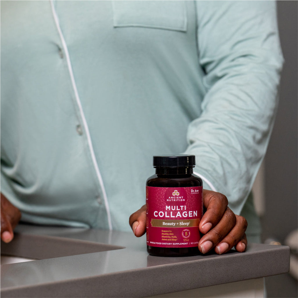 a person holding a bottle of Multi Collagen Beauty & Sleep Support Capsules (90 Capsules)