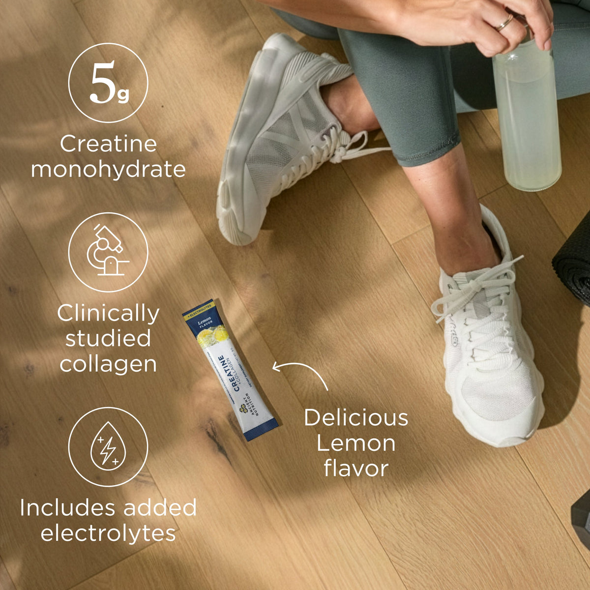 Person sitting on a wooden floor with a protein powder stick pack and water bottle, highlighting ingredients and flavors.