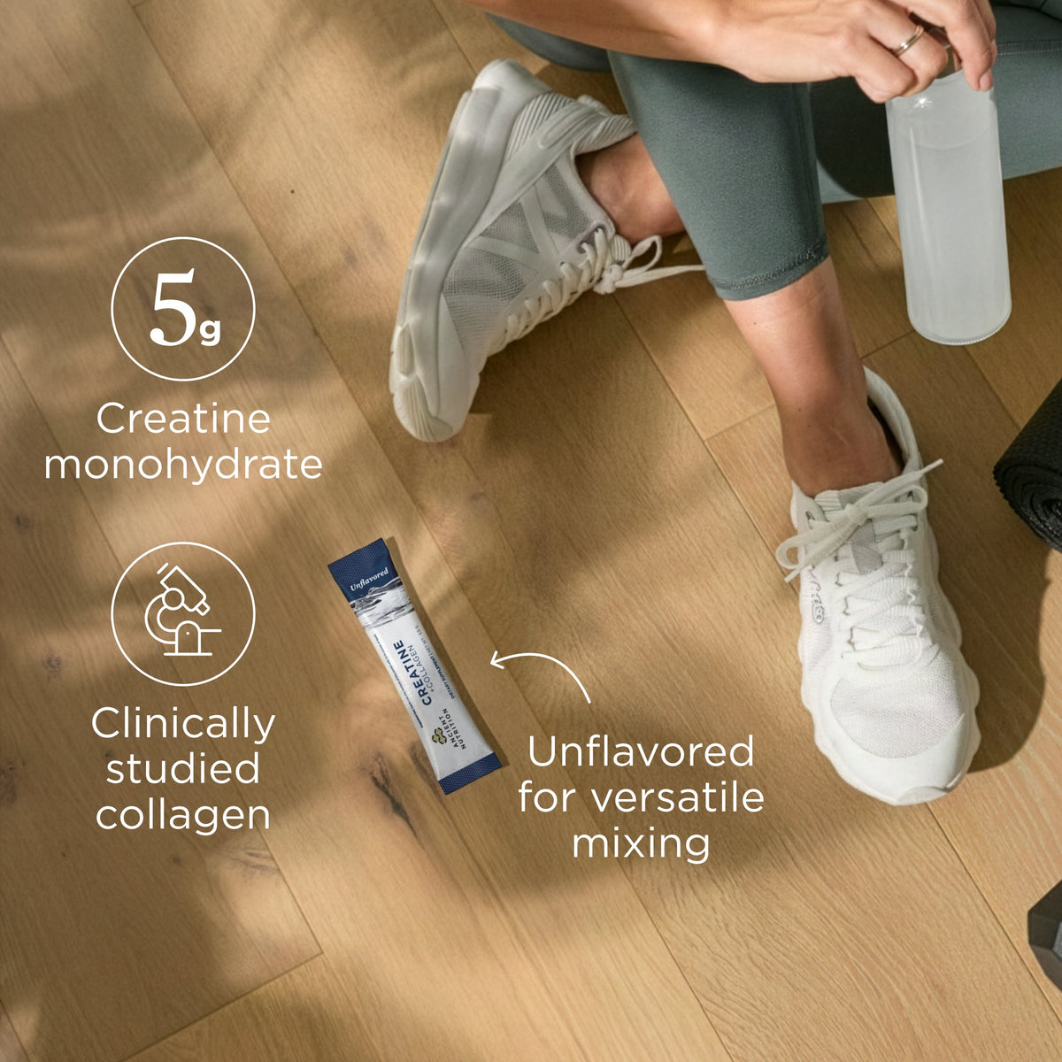 Person sitting on a wooden floor with a protein powder stick pack and water bottle, highlighting ingredients and benefits.