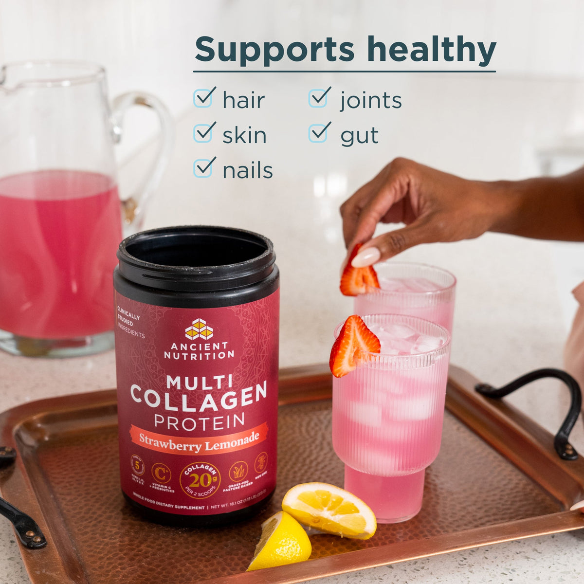 a bottle of Multi Collagen Protein Powder Strawberry Lemonade with text that says supports healthy hair, skin, nails, joints and gut