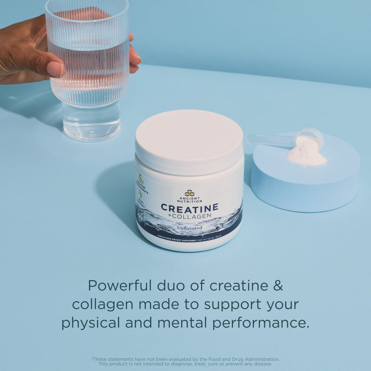 Creatine and collagen supplement jar with a glass of water on a light blue background