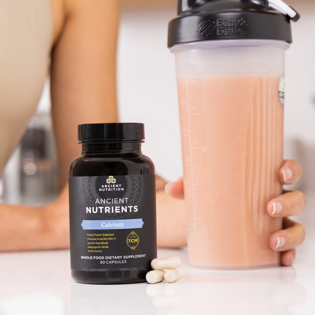 ancient nutrients calcium next to shaker bottle