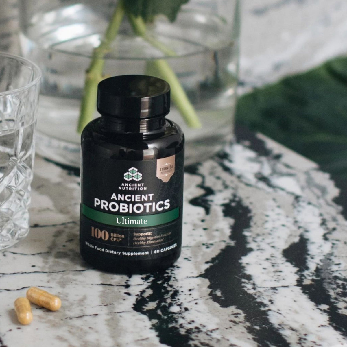 a bottle of Ancient Probiotics Ultimate Capsules on a marble counter top
