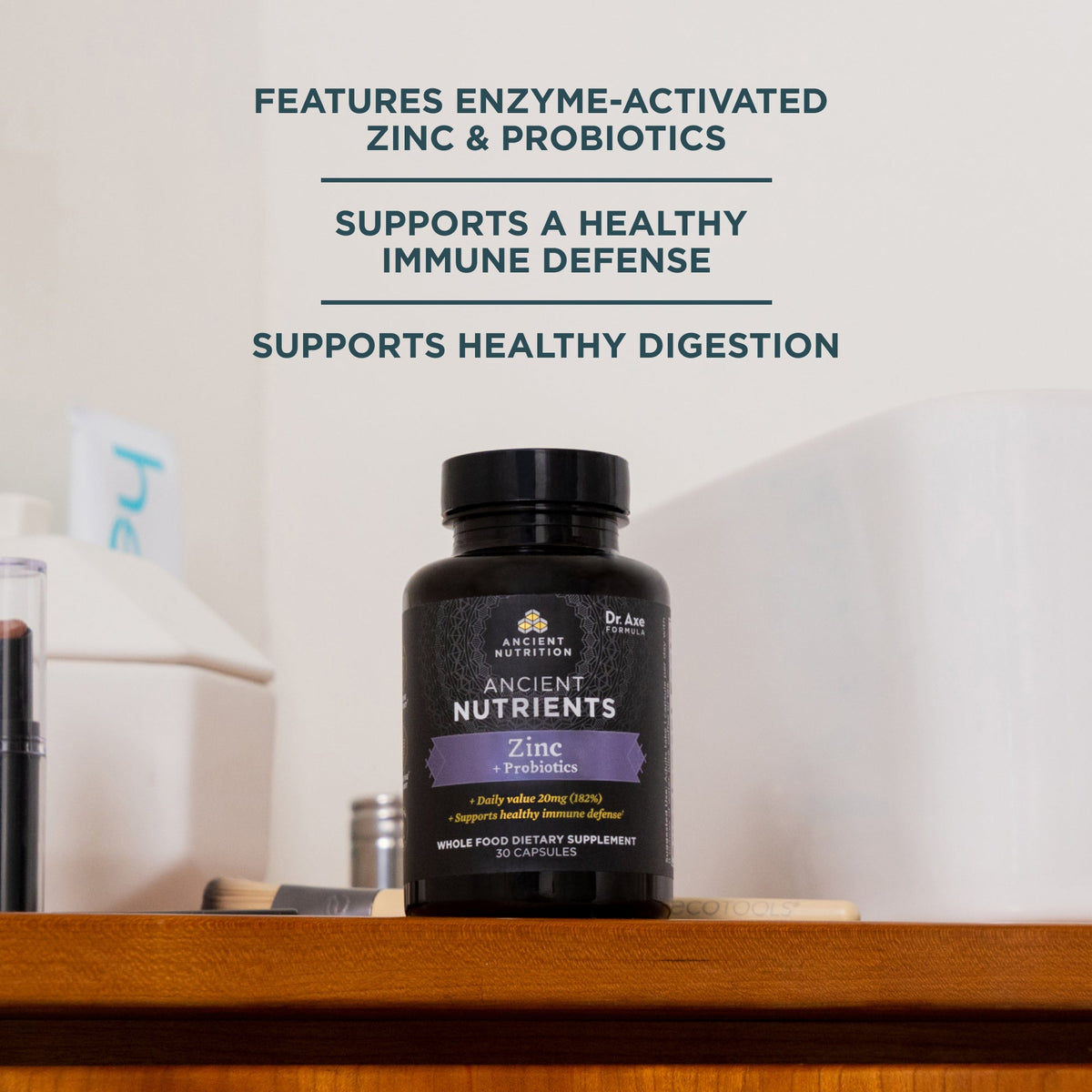 a bottle of Ancient Nutrients Zinc + Probiotics Capsules (30 Servings) on a wooden shelf