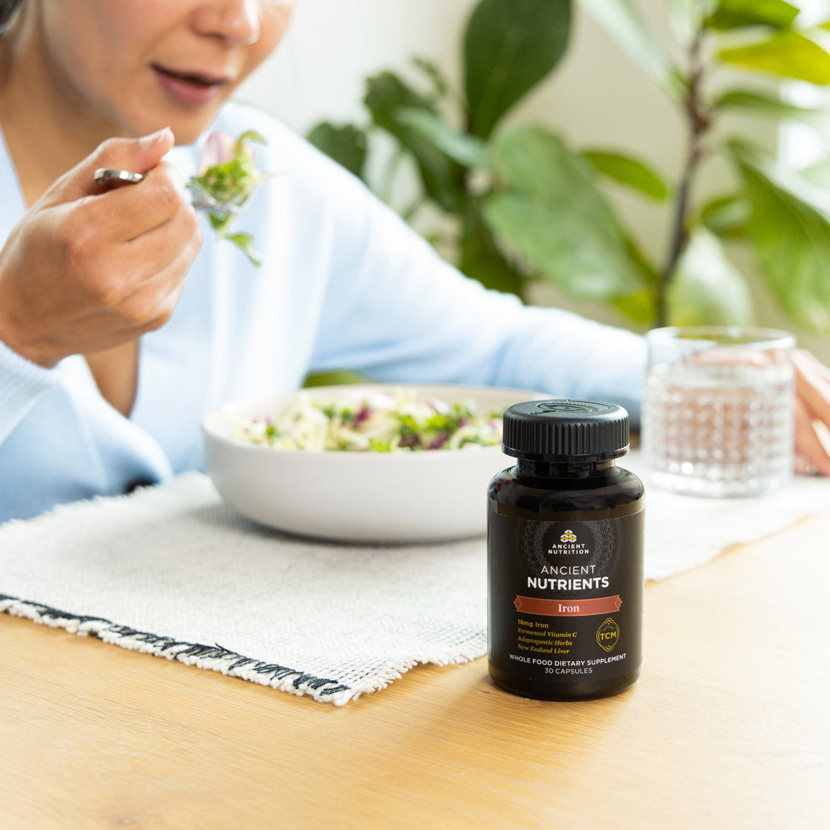 a woman eating a salad