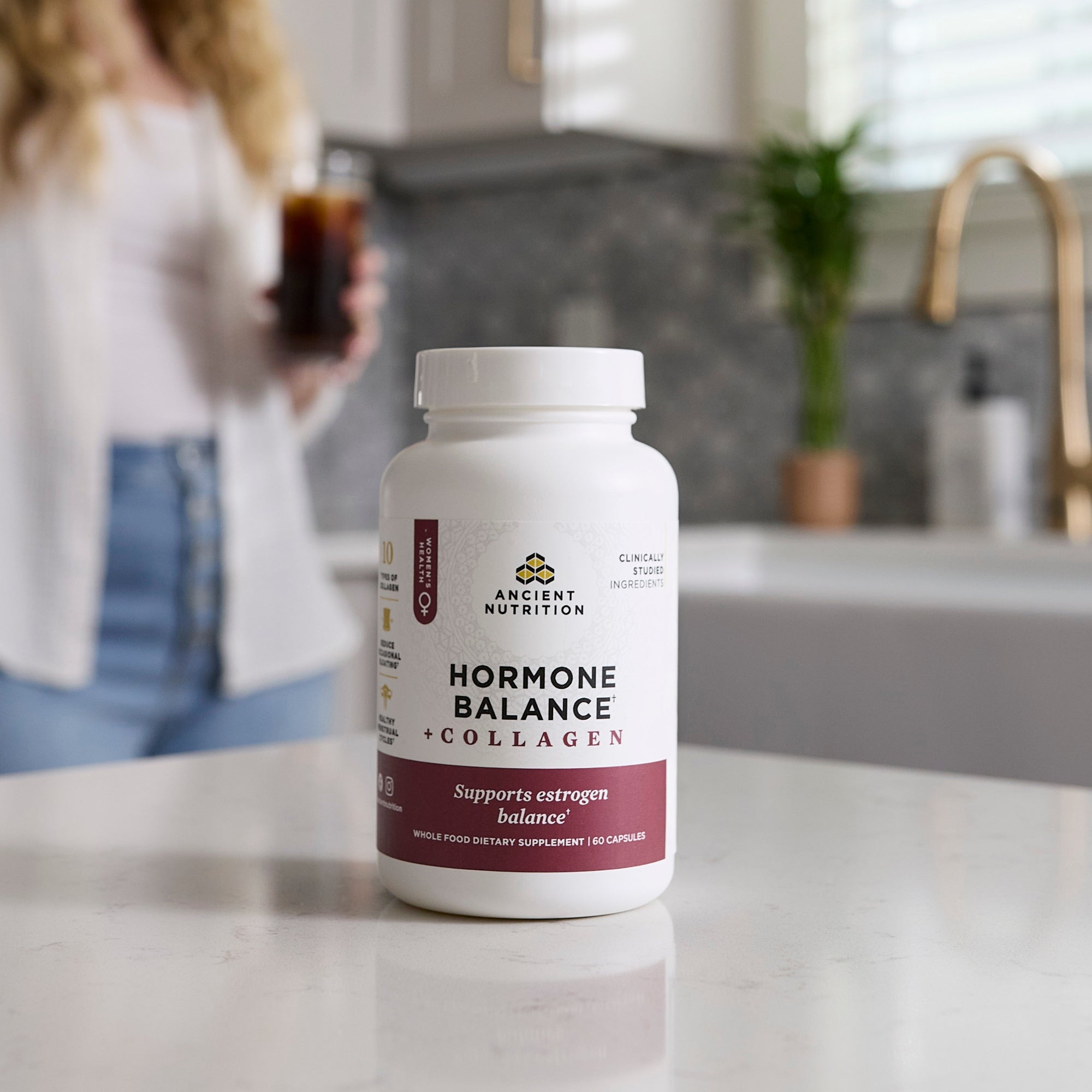 a bottle of Hormone Balance + Collagen Capsules on a kitchen counter