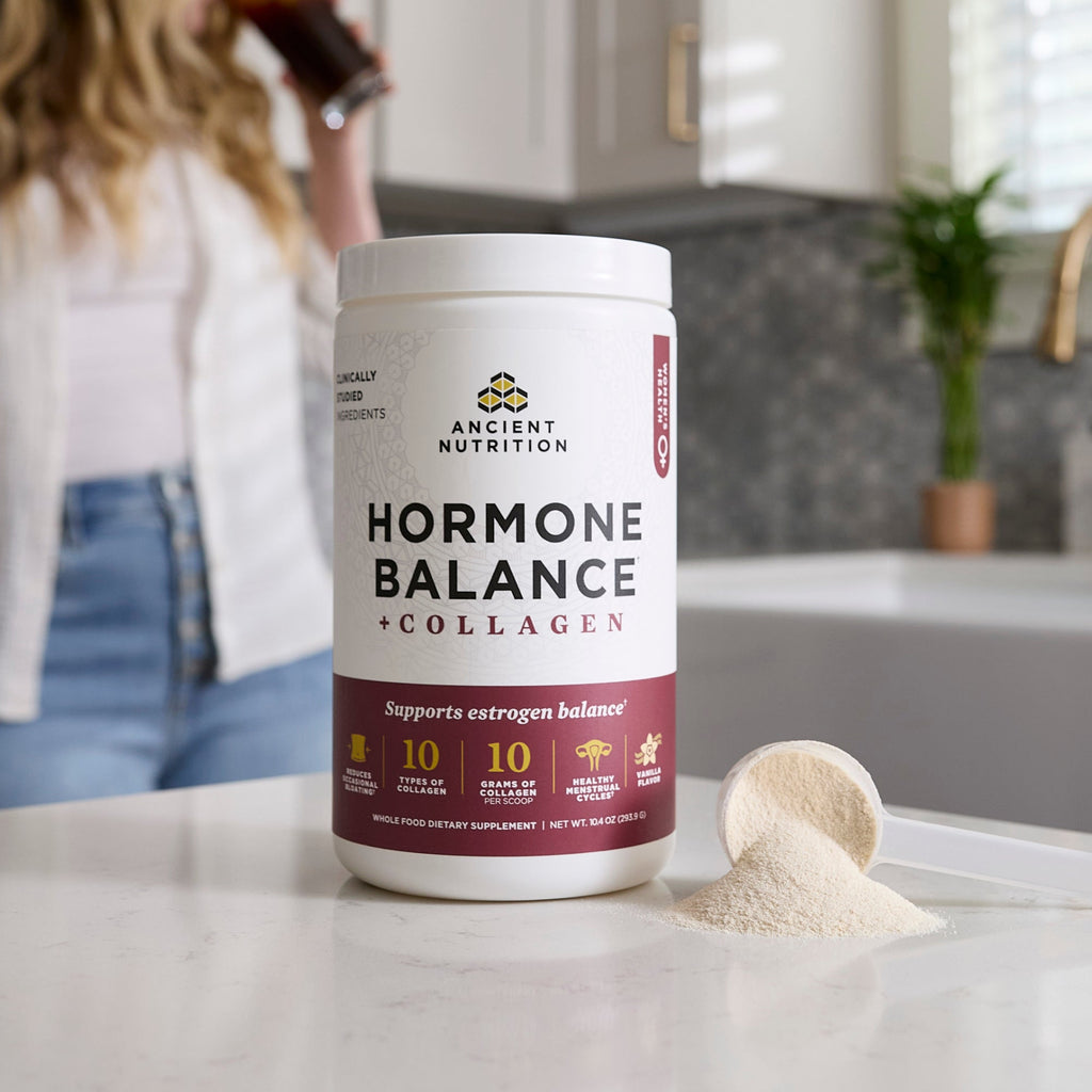 a bottle of Hormone Balance + Collagen Powder Vanilla on a counter