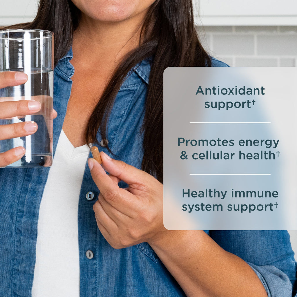 Woman holding a glass of water with health benefits text overlay