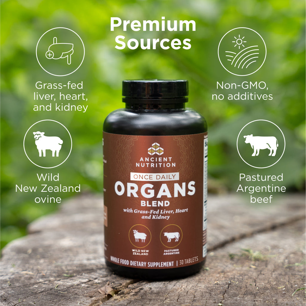 a bottle of Organs Blend Once Daily Tablets on a tree stump with product benefits
