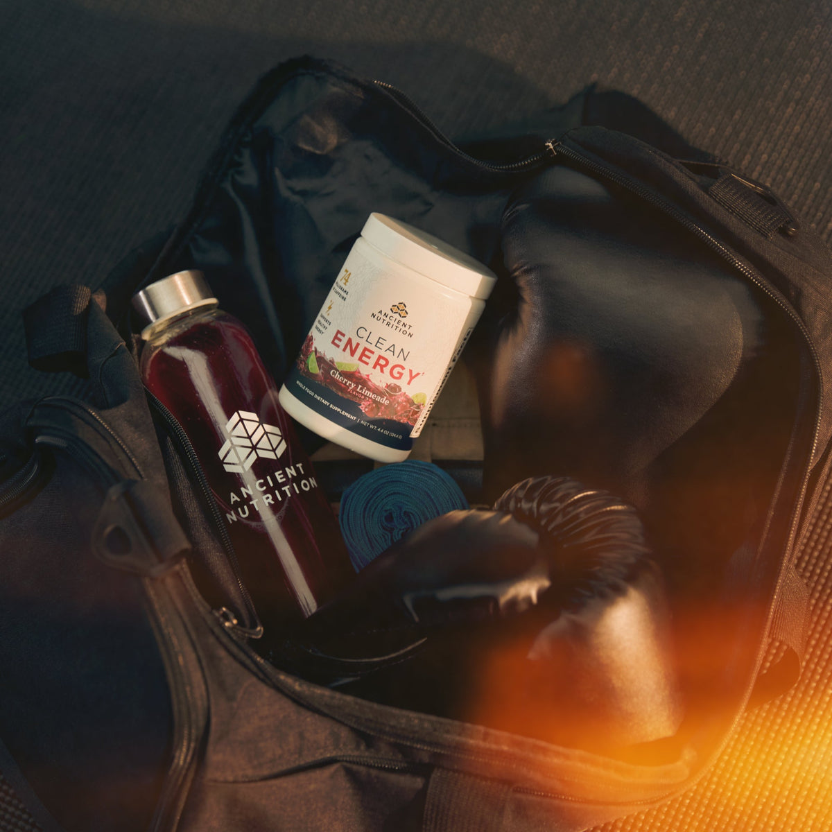 a bottle of Clean Energy Powder Cherry Limeade Flavor (30 Servings) in a workout bag