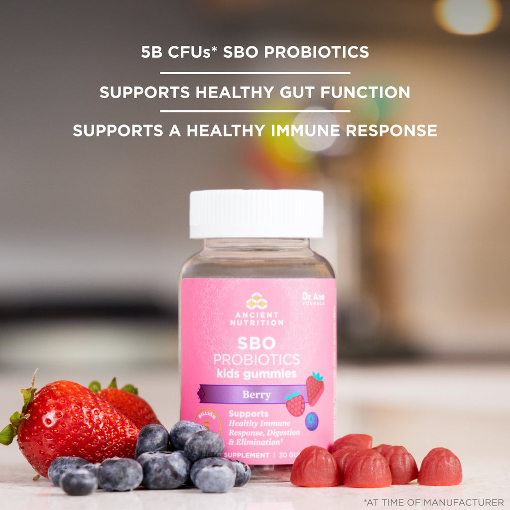 a bottle of SBO Probiotics Kids Gummies Berry surrounded by fresh fruit