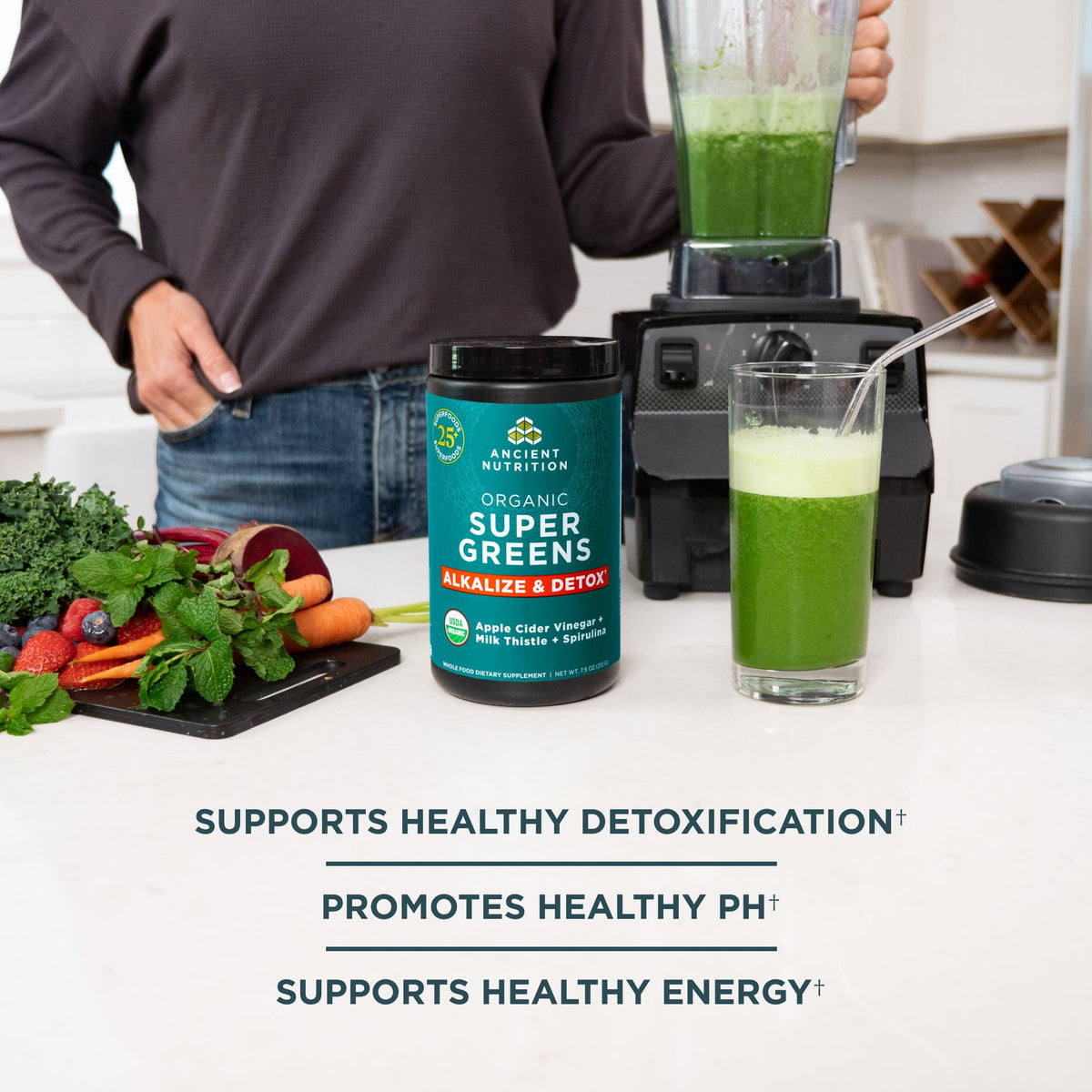 a bottle of Organic SuperGreens Alkalize & Detox Powder next to a blender