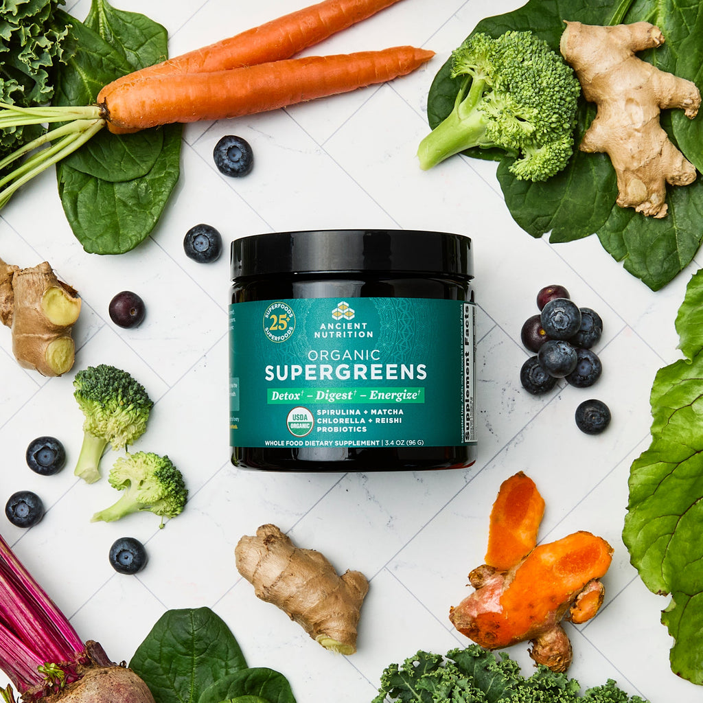 Organic SuperGreens Powder Greens Flavor (12 Servings) surrounded by fruits